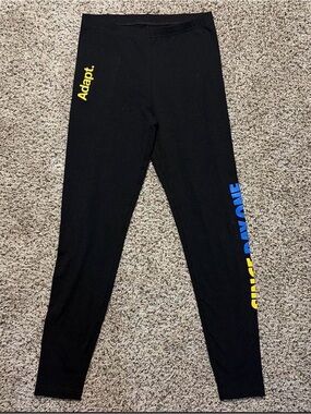Adapt Leggings with Yellow and Blue Accent that reads “SINCE DAY ONE”
